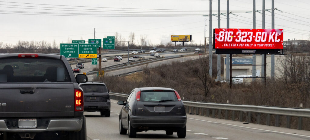 816-323-GO KC billboard in Kansas City, MO.